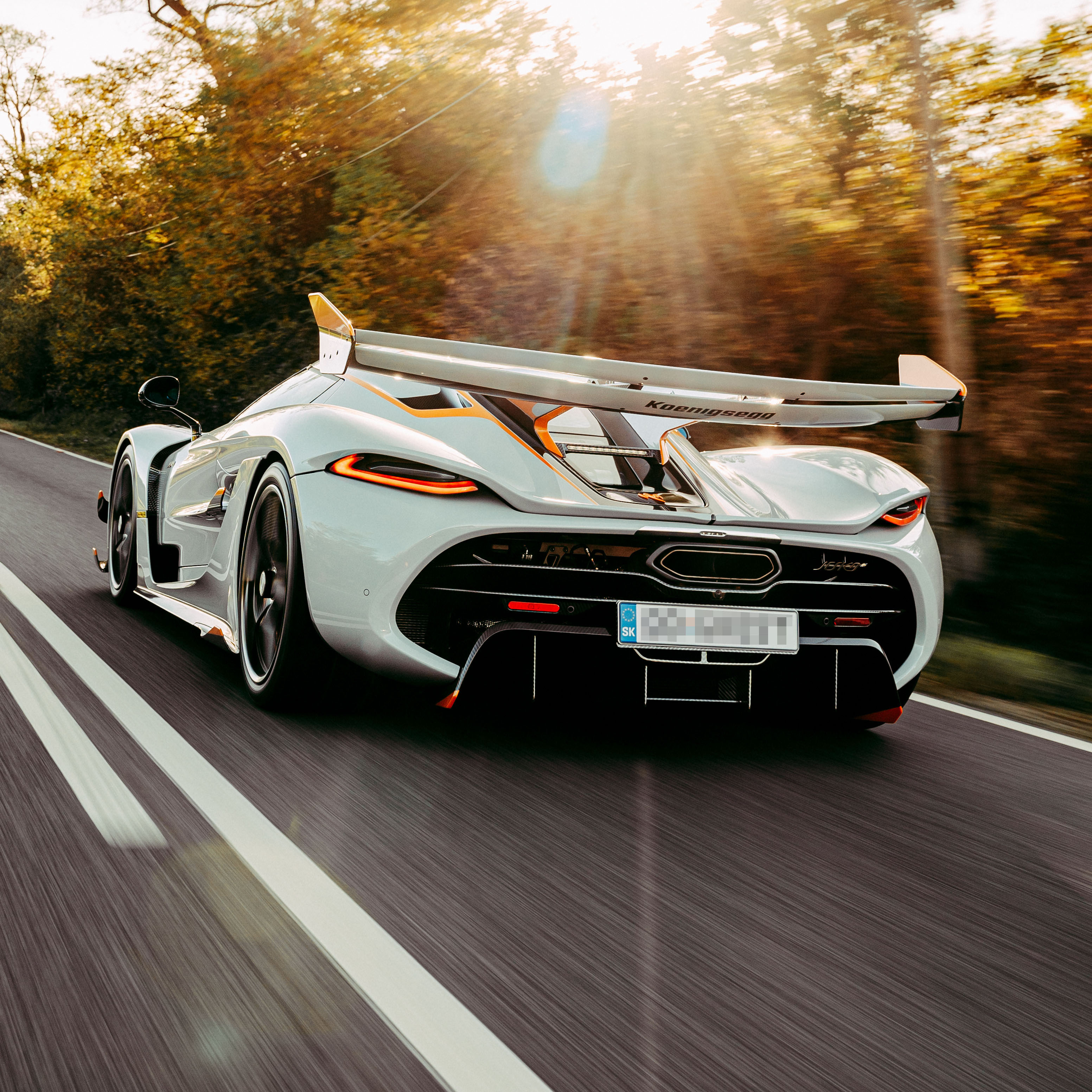 young man side profile having beard trimmed with scissors